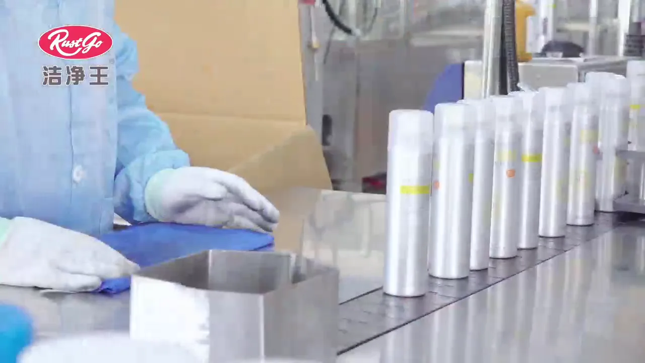 Worker handling aerosol cans on a company production and packaging station